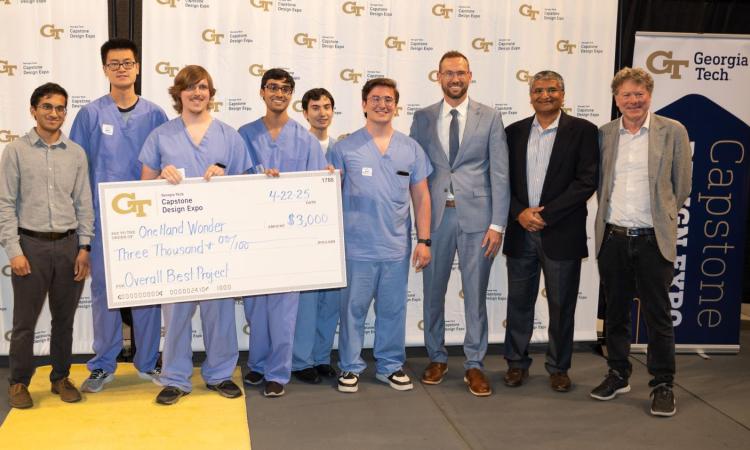 winners holding an oversized check
